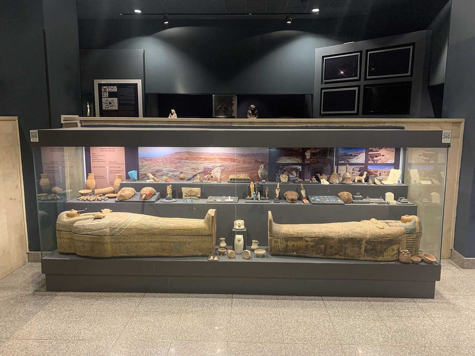 Museum showcase in Luxor with objects viewed through glass