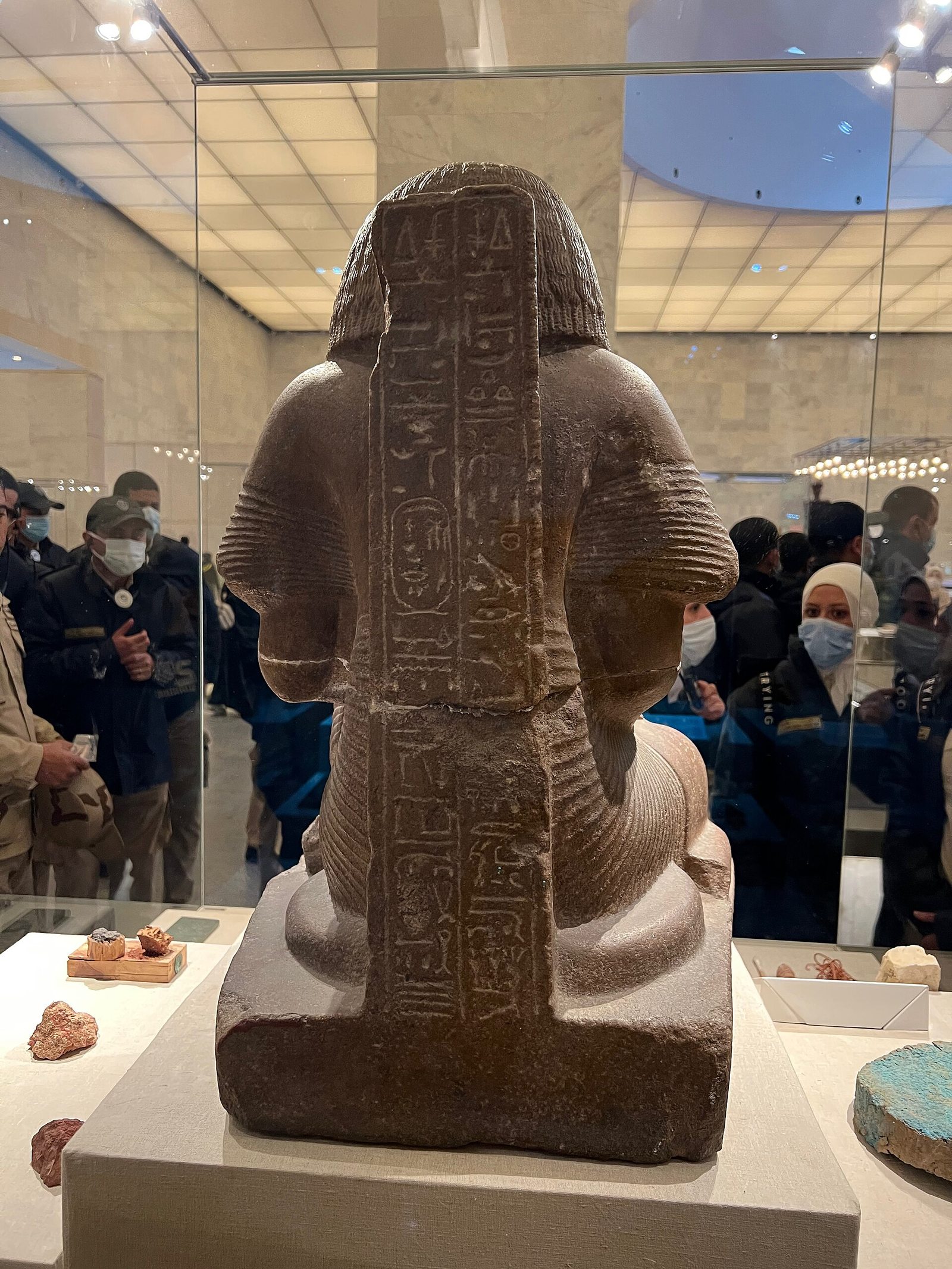 Museum object displayed on a modern support at the National Museum of Egyptian Civilization